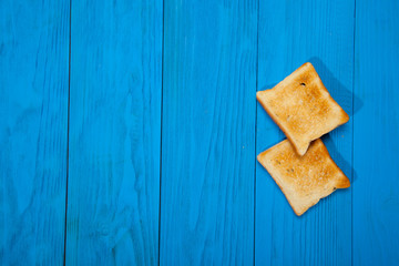 Toast on a wooden blue background