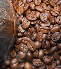Hot roasted coffee beans with a turkish cezve
