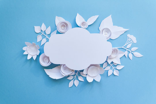 vintage frame with paper flowers on the blue background