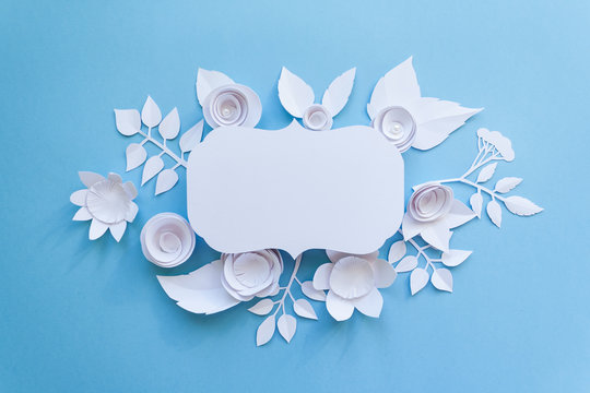 vintage frame with paper flowers on the blue background