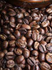 Fototapeta premium Hot roasted coffee beans with a turkish cezve