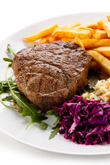 Grilled steak with french fries and vegetables