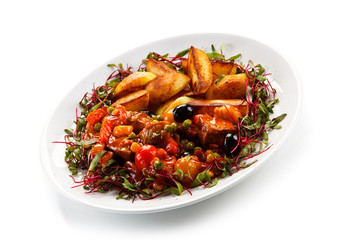 Roasted meat and potatoes with vegetables