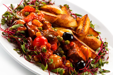 Roasted meat and potatoes with vegetables