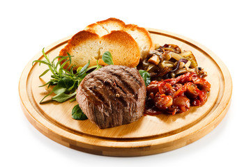 Grilled steak with toasted buns and vegetables