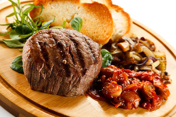 Grilled steak with toasted buns and vegetables