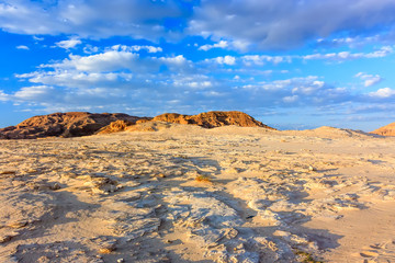 Long shadows over an arid desert