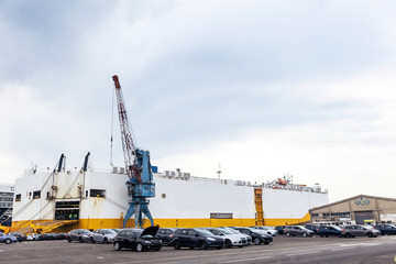 Fototapeta na wymiar Car Freighter and Cars in Commercial Port
