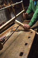 Carpenter working. Carpenter tools on wooden table with sawdust. Carpenter workplace