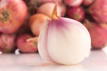Red sliced onion isolated on white background