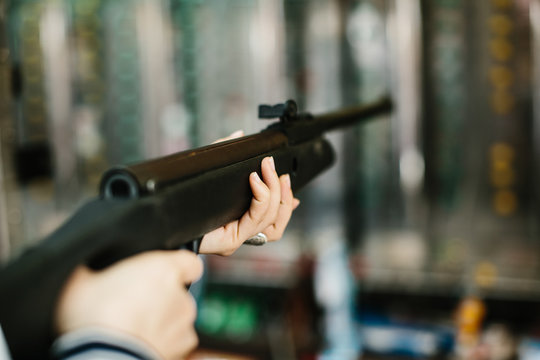 Woman aiming in shooting range
