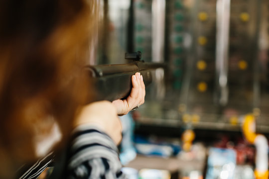 Woman aiming in shooting range