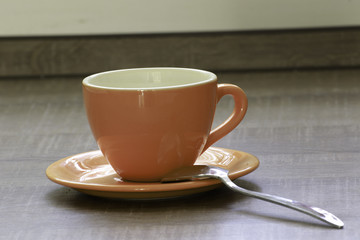ceramic coffee cup and saucer
