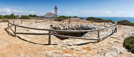 Panoramic view of beacon and karst cave at Algarve, South Portugal. Touristic route along the Atlantic Coast.
