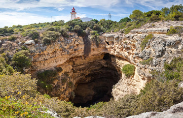 Panoramic view of beacon and karst cave at Algarve, South Portugal. Touristic route along the...