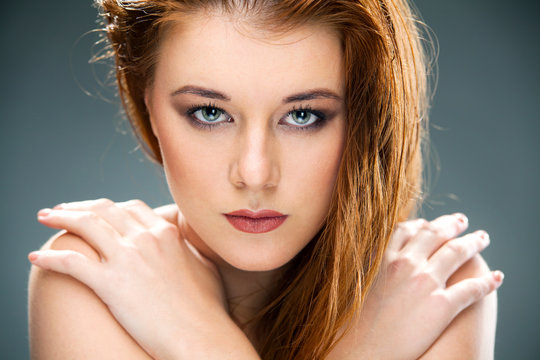 Portrait of a beautiful female model on dark background