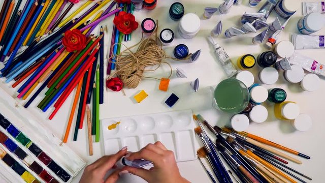 Timelapse: artist working with palette. Top view 4K