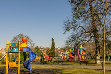 Fototapeta na wymiar Playground for children in urban park