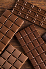 Bars Chocolate , candy sweet, dessert food on wooden background