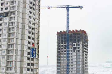 Fototapeta premium Construction of an apartment building. Crane