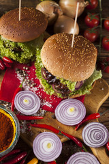 Close-up of home made burgers, wooden desk background