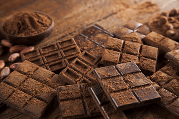 Chocolate bar, candy sweet, dessert food on wooden background