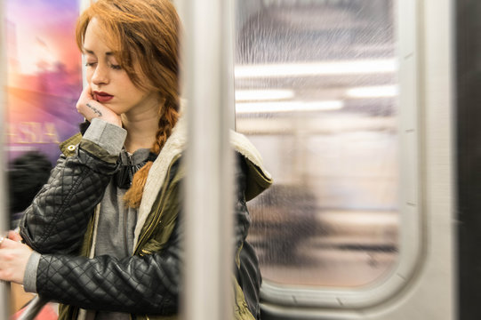 Tired woman sleeping on the subway