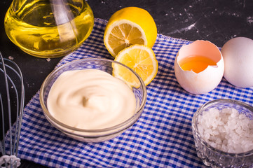 Mayonnaise on a dark background. Ingredients mayonnaise