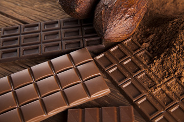 Chocolate sweet, cocoa pod and food dessert background