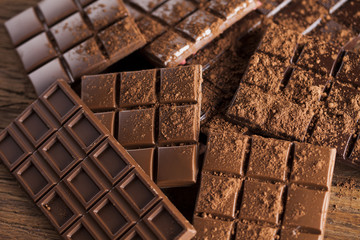 Bars Chocolate , candy sweet, dessert food on wooden background