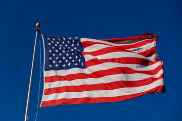 Obraz premium American Flag against blue sky