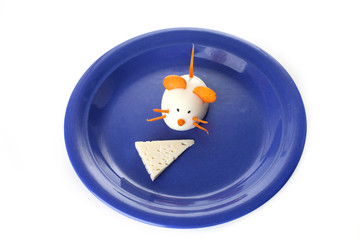 Food art creative concepts. Cute mouse on blue plate over white background.