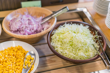 Salads on buffet table at restaurant .