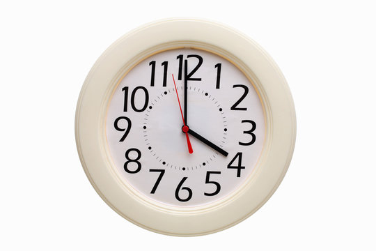 Analog wall clock showing four o'clock