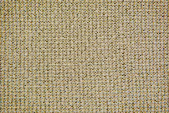 Vintage linen fabric with brilliance golden lurex. Texture of natural raw material for the background.