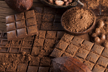Dark and milk chocolate bar on a wooden table