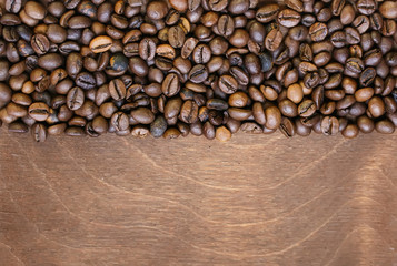  background of the many fragrant fried coffee beans on old wooden table