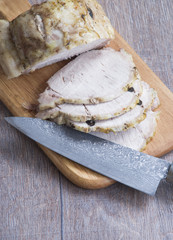 Cutting cold boiled pork to slices