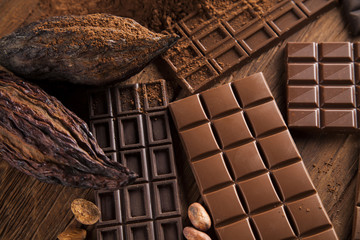 Chocolate sweet, cocoa pod and food dessert background