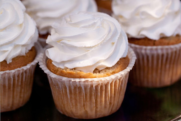 several cakes basket with whipped cream 