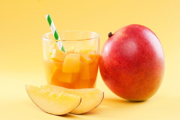 cubes of mango pulp isolated on a yellow background