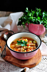 Delicious organic soup with chicken, beans, onions, tomatoes, mushrooms and parsley.