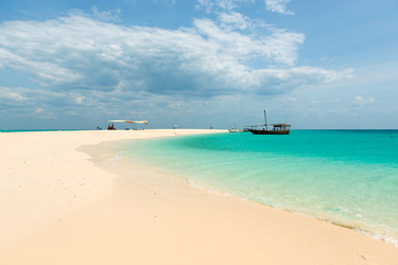 Fototapeta na wymiar Zanzibar beach and touristic boats in the ocean