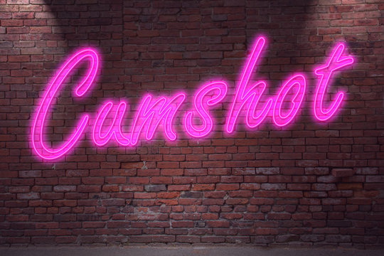 Leuchtreklame Cumshot an Ziegelsteinmauer
