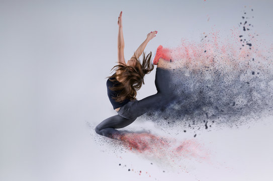 Woman In Jump. Frozen Motion. Photo Manipulation Of Disintegration