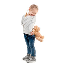 Girl peaking on a teddy, isolated