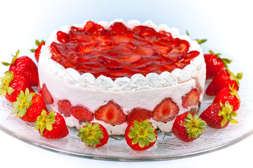 Yogurt cake with strawberries on glass plate