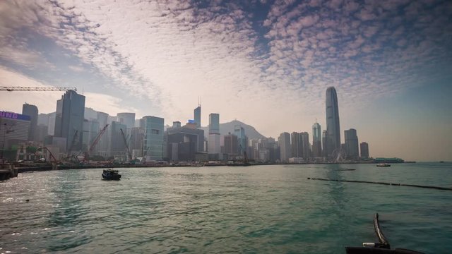 sunset sunny day hong kong bay dock construction cityscape panorama 4k time lapse china
