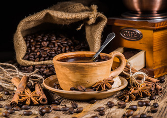 Coffee cup and saucer on a wooden table.