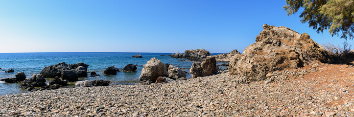 Fototapeta na wymiar Rocky coastline with turquoise lagoon near Paleochora town on Crete island, Greece